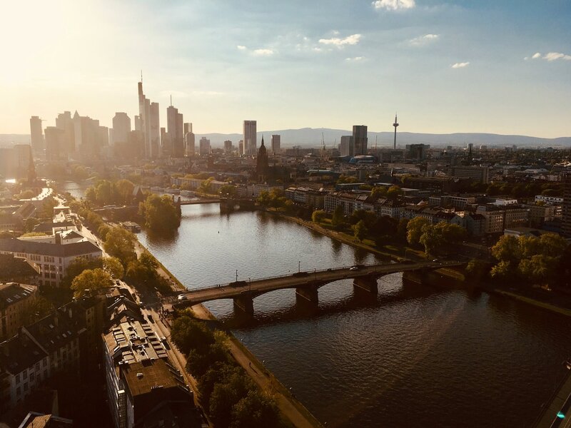 River between city buildings during daytime