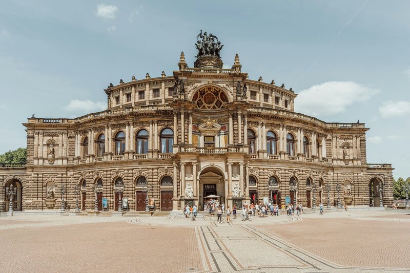 a large building with a statue on top of it
