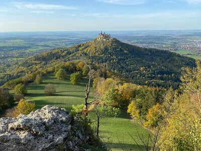 Burg Hohenzollern: a landscape with trees and hills