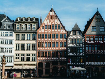 Römerberg: Row of historic timber-framed buildings under blue sky