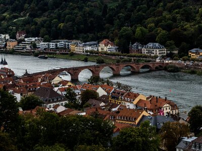 Old Bridge: A river running through a city next to a bridge