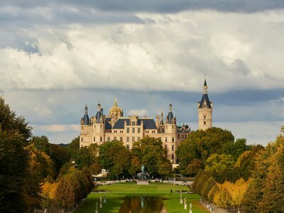 Schwerin Castle: A large castle with a pond in its middle