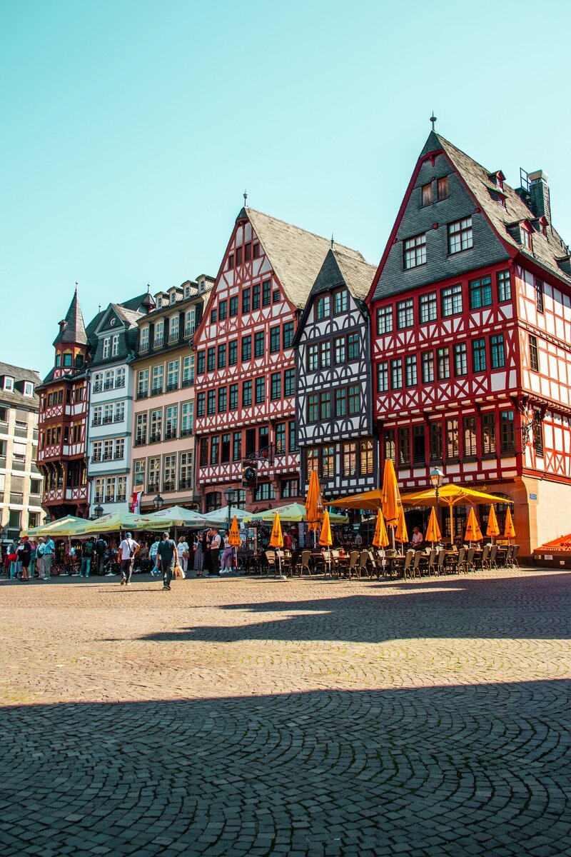 Historic buildings and a plaza in a european city.
