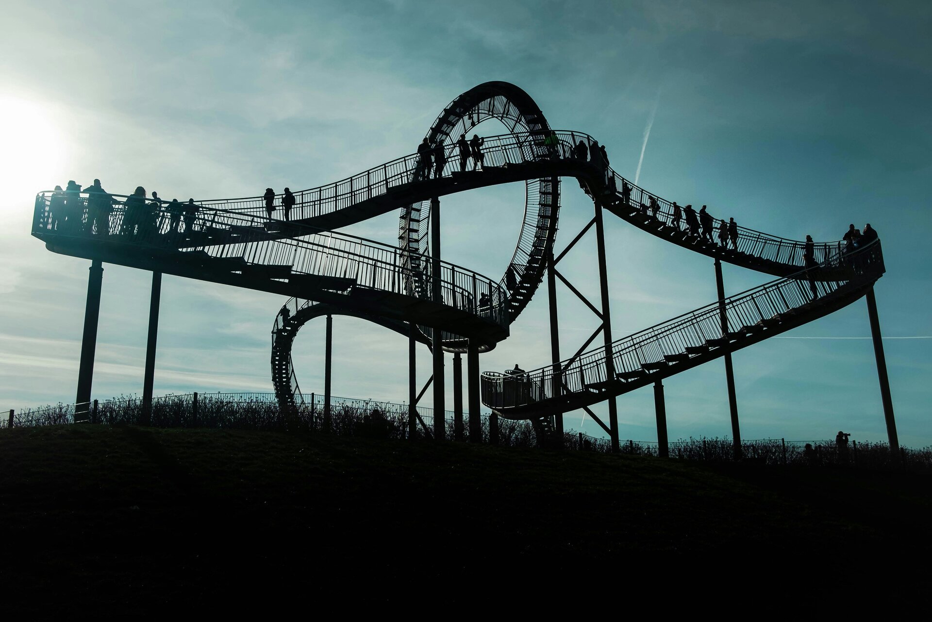 Fotospot Tiger & Turtle: gray metal bridge under white clouds